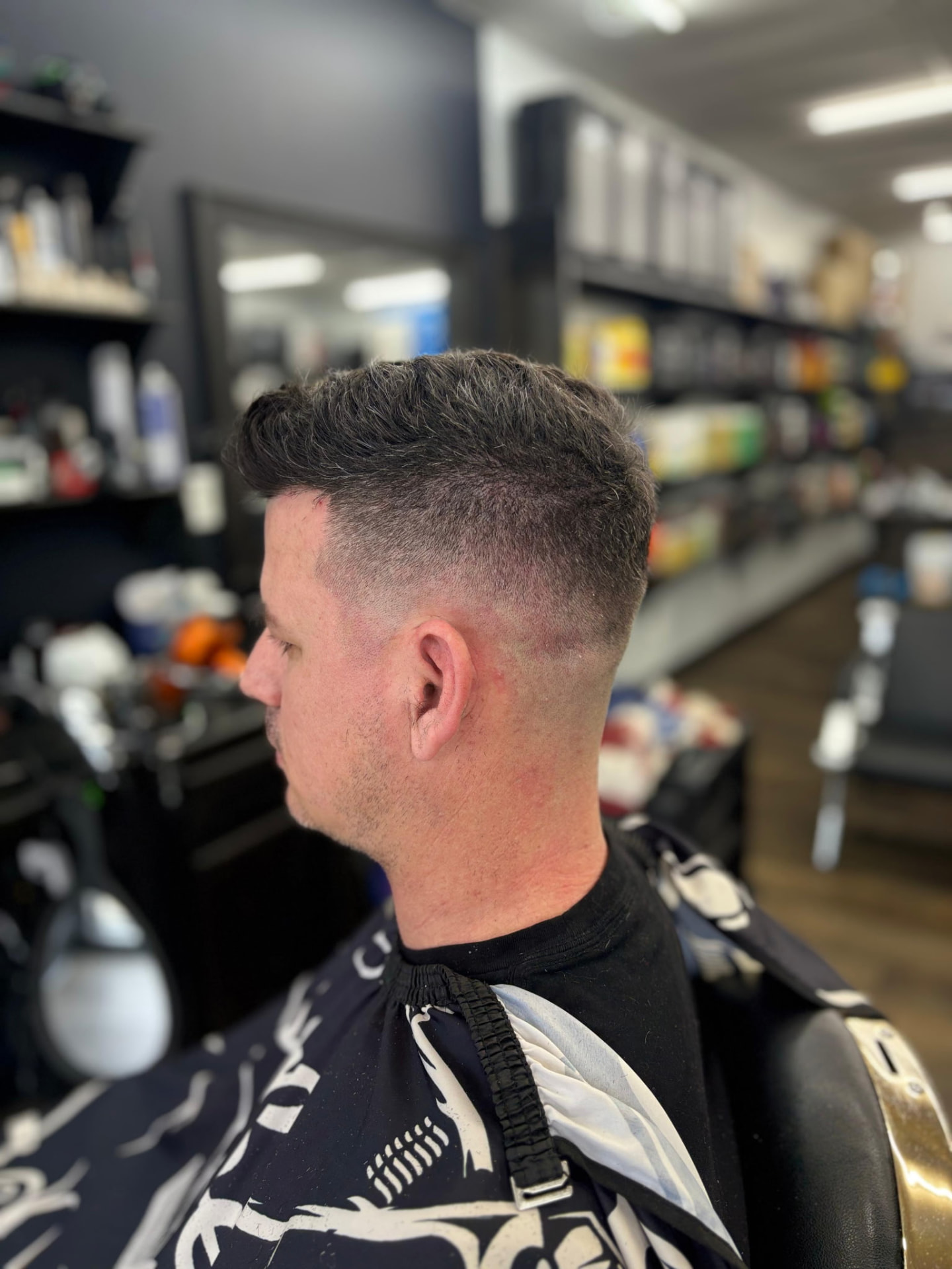 Textured haircut with a precise fade at Ivan's Barbershop